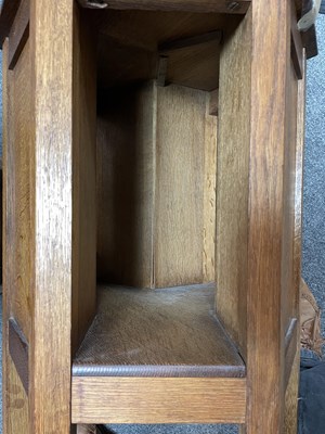 Lot 431 - A pair of Arts & Crafts oak hexagonal bedside tables