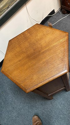 Lot 431 - A pair of Arts & Crafts oak hexagonal bedside tables