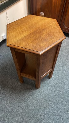 Lot 431 - A pair of Arts & Crafts oak hexagonal bedside tables