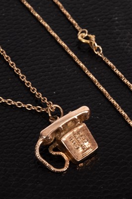 Lot 103 - A 9ct gold telephone charm
