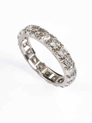 Lot 235 - A white metal and diamond full eternity ring