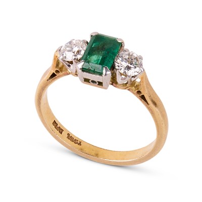 Lot 236 - An 18ct yellow gold, emerald and diamond three-stone ring