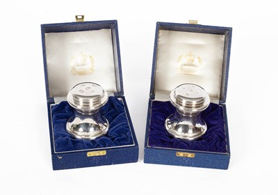 Lot 401 - A pair of HM Queen Elizabeth II Silver Jubilee silver mounted paperweights