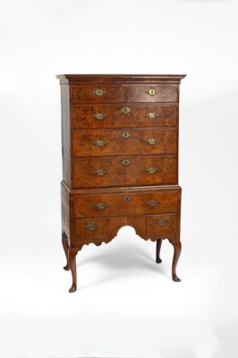 Lot 177 - A Queen Anne figured walnut chest on stand