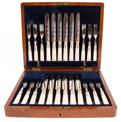 Lot 438 - A set of twelve mother-of-pearl handled dessert knives and forks