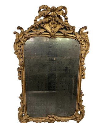 Lot 682 - A gilt carved overmantel mirror