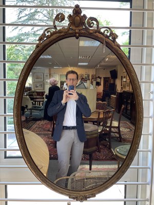 Lot 40 - A 19th Century oval gilt wall mirror