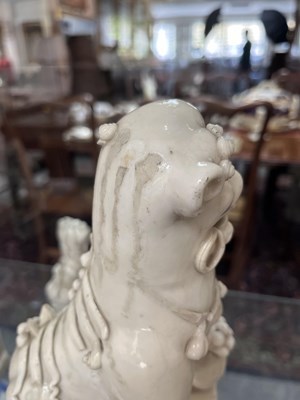 Lot 23 - A Chinese blanc de chine figure of a dog of Fo