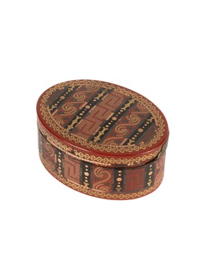 Lot 155 - A George III tortoiseshell, red lacquer and inlaid two-coloured gold oval snuff box