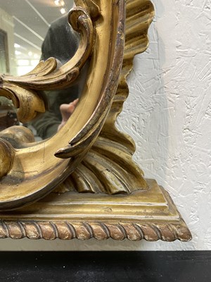 Lot 106 - A giltwood overmantel mirror