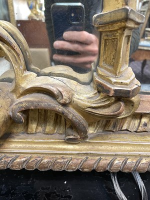 Lot 106 - A giltwood overmantel mirror