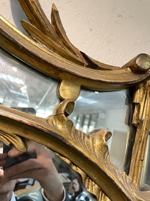 Lot 106 - A giltwood overmantel mirror