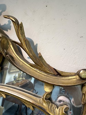 Lot 106 - A giltwood overmantel mirror