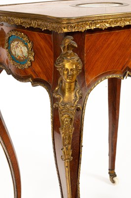 Lot 46 - A French gilt brass mounted kingwood and tulipwood centre table