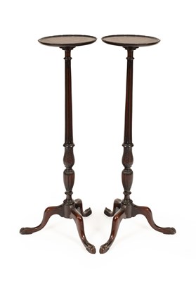 Lot 223 - A pair of Edwardian mahogany fluted column tripod torchères