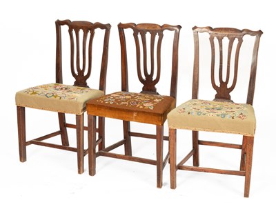 Lot 103 - Three George III country made stained elm dining chairs