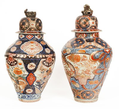 Lot 299 - Two Japanese Imari large baluster vases with domed covers