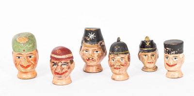 Lot 986 - Six Austrian painted and decorated carved wood puppet heads