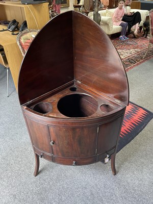 Lot 54 - A George III mahogany corner washstand