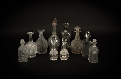 Lot 298 - A group of ten cut glass decanters and some stoppers