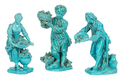 Lot 37 - A pair of  Minton turquoise glazed figures of gardeners