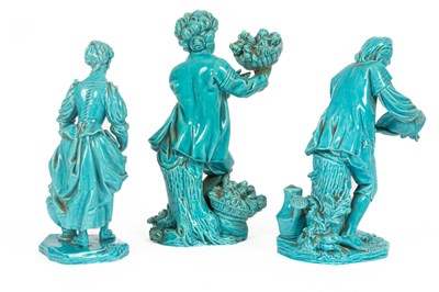 Lot 37 - A pair of  Minton turquoise glazed figures of gardeners