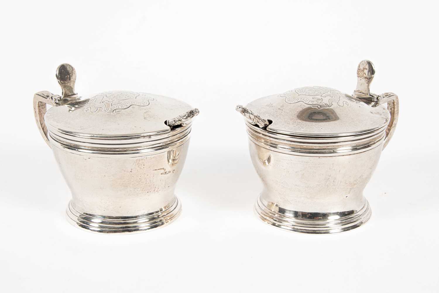 Lot 39 - A near pair of silver mustard pots