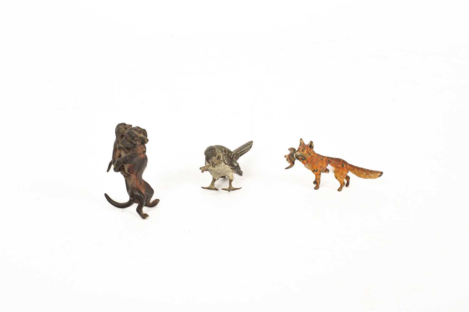 Lot 571 - A cold painted bronze figure of a fox with a duck in its mouth