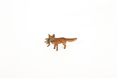 Lot 571 - A cold painted bronze figure of a fox with a duck in its mouth