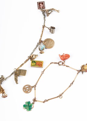 Lot 269 - An early 20th Century bi-colour gold trombone link charm bracelet