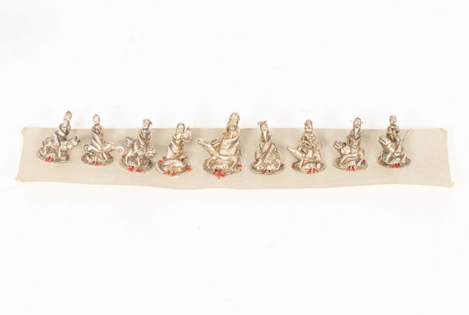 Lot 149 - A set of nine Chinese silver hat ornaments