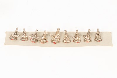 Lot 149 - A set of nine Chinese silver hat ornaments