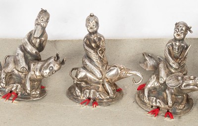 Lot 149 - A set of nine Chinese silver hat ornaments