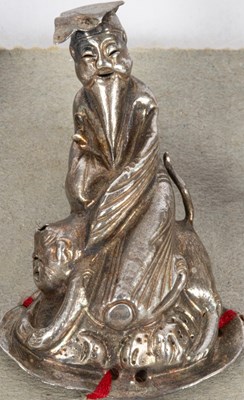 Lot 149 - A set of nine Chinese silver hat ornaments
