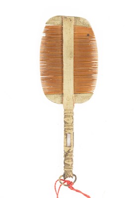 Lot 617 - A Chinese miniature double-sided white brass pocket comb