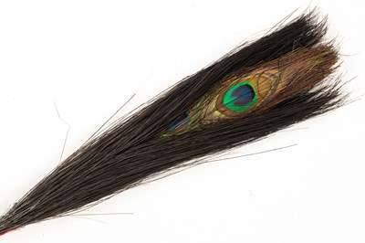 Lot 128 - A Chinese double-eyed peacock feather for court official's winter court hat