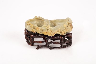 Lot 39 - A Chinese celadon jade carved brush washer