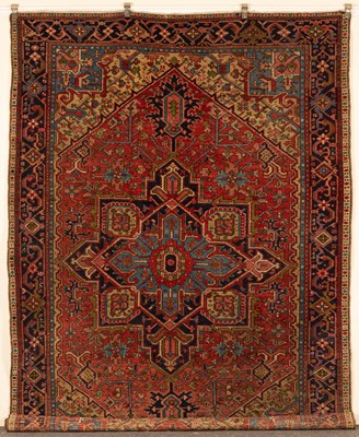 Lot 384 - A small Heriz carpet