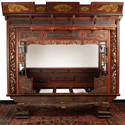 Lot 607 - A Chinese carved wood opium bed