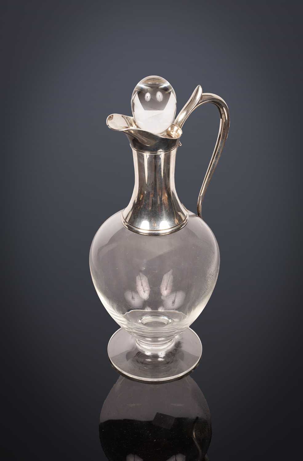 Lot 322 - A Dartington glass claret jug with silver mounts