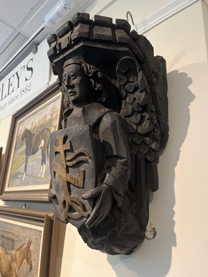 Lot 192 - A matching set of large carved oak angel corbels