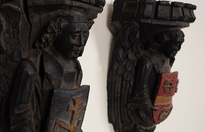 Lot 192 - A matching set of large carved oak angel corbels