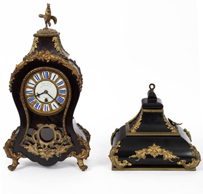 Lot 747 - A gilt metal mounted ebonised case mantle clock