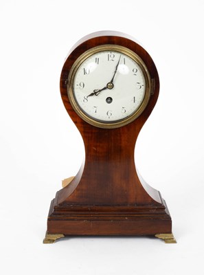 Lot 752 - A mahogany balloon mantel timepiece