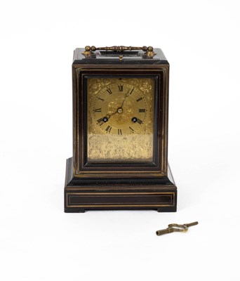 Lot 754 - A French ebonised mantel clock