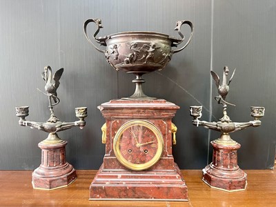 Lot 756 - A French marble and bronze mantel clock garniture