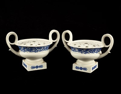 Lot 141 - A pair of Wedgwood white stoneware potpourri vases and pierced covers