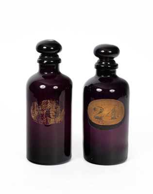 Lot 811 - A pair of 19th Century amethyst glass apothecary’s bottles and stoppers