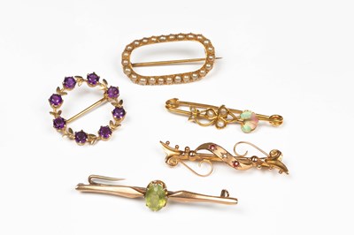 Lot 373 - Five Edwardian and later gem set brooches