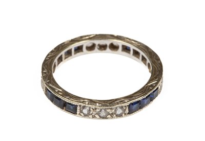 Lot 377 - A diamond and sapphire eternity ring